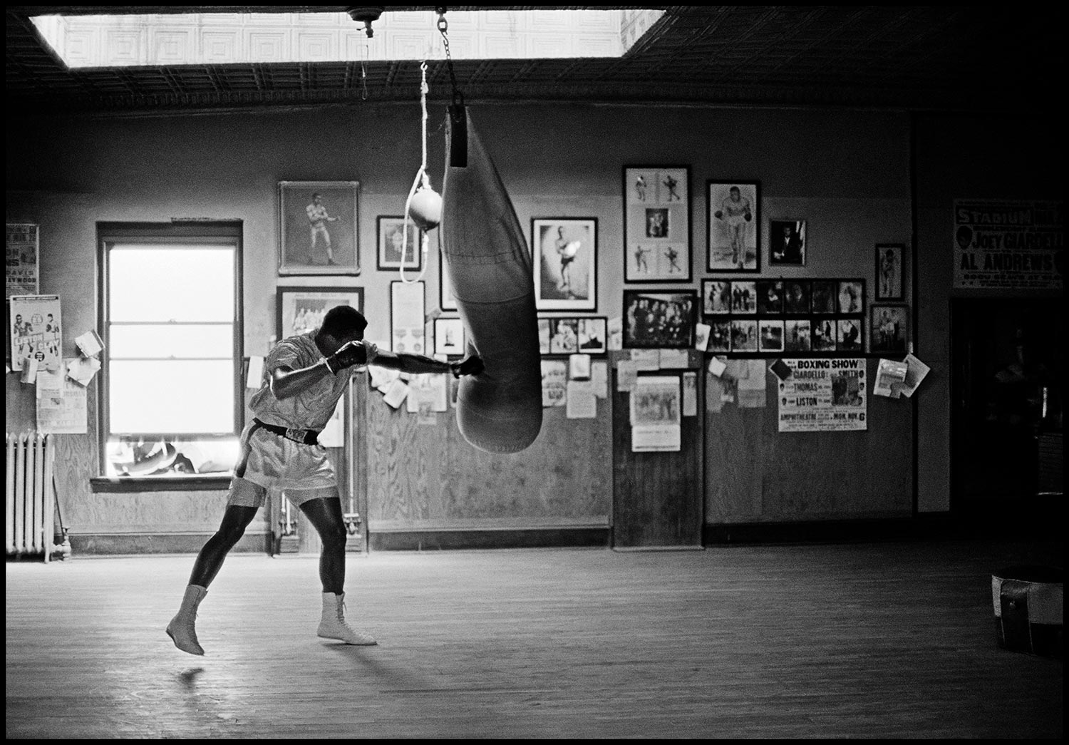 Muhammad Ali hitting the heavybag 