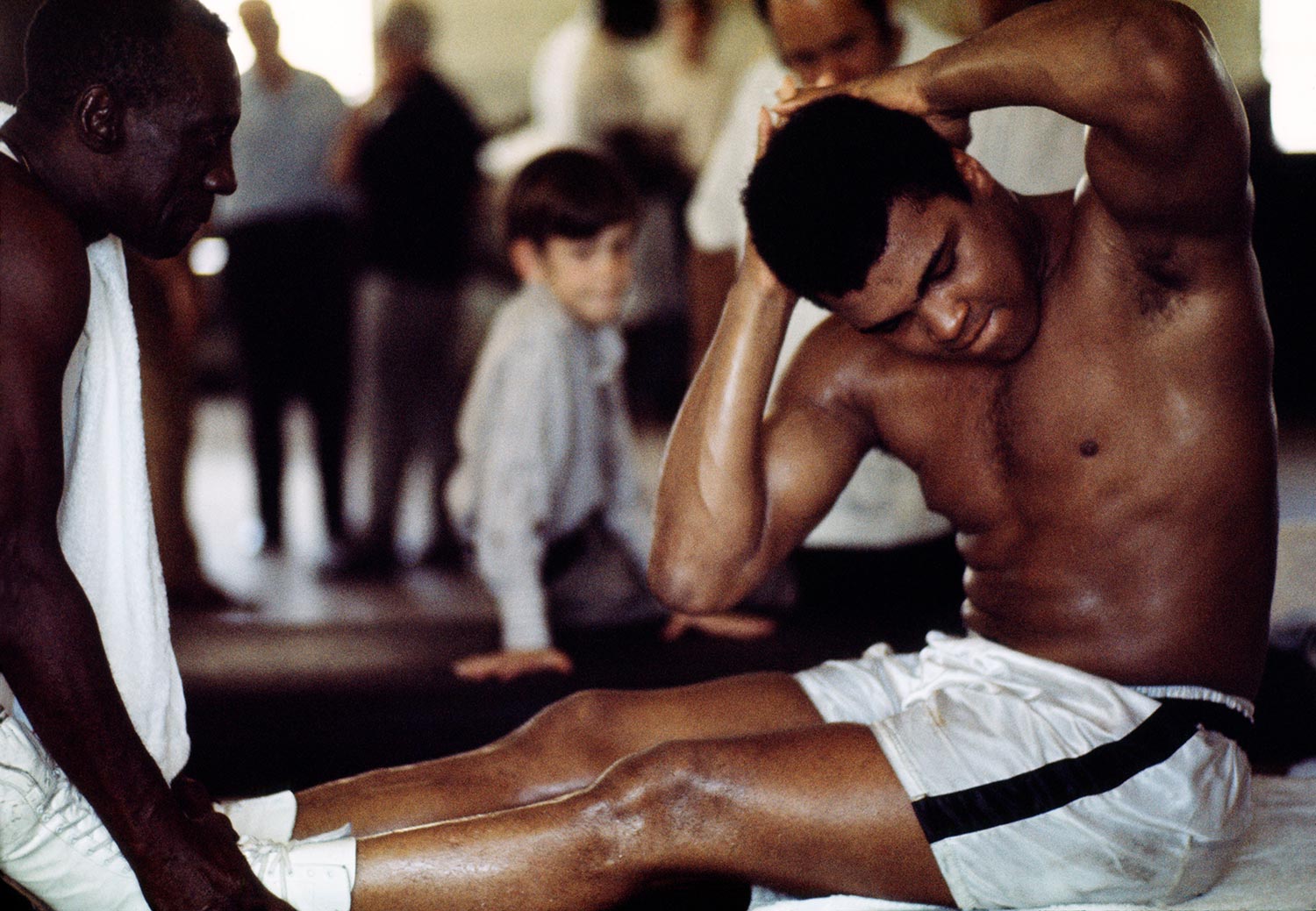 Muhammad Ali performing crunches