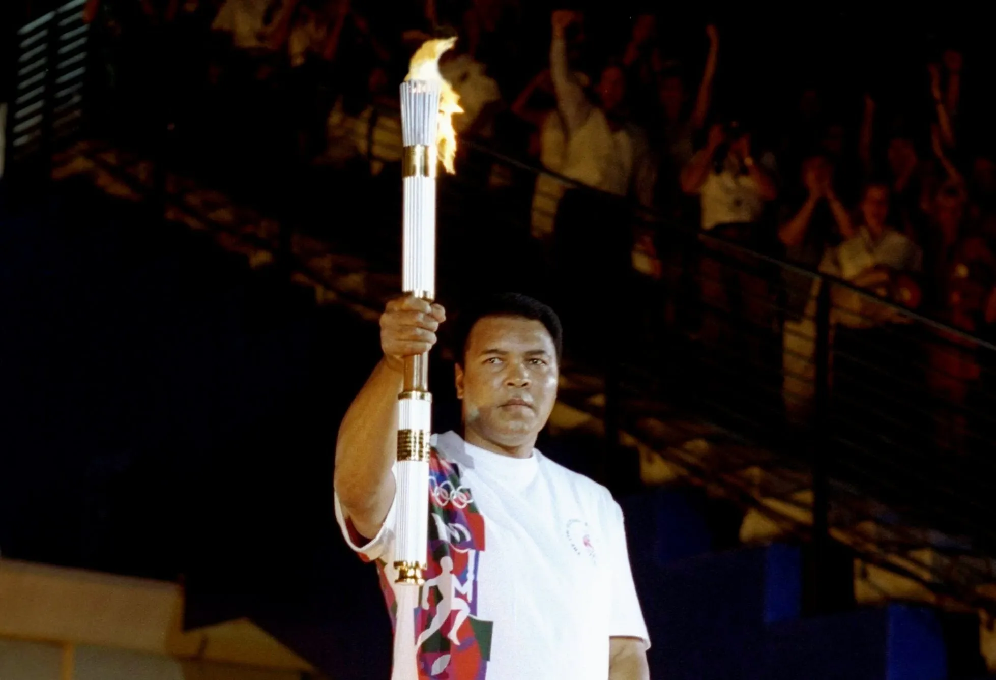 Muhammad Ali holding the Olympic torch