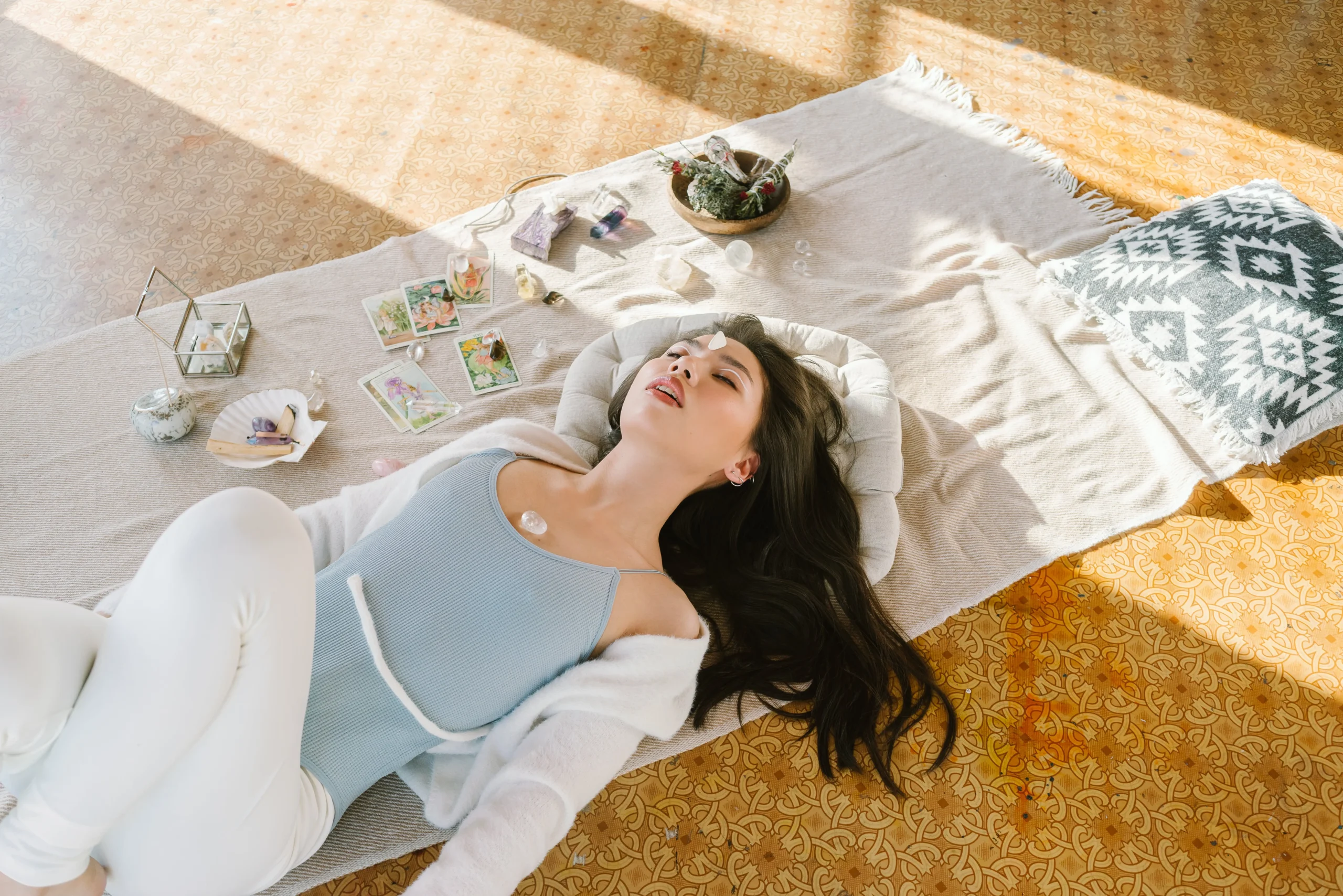 Woman sleeping with a chakra stone resting on her chest