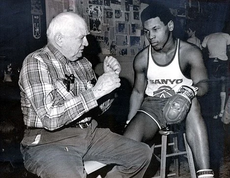 14 year old Mike Tyson with Cus D' Amato in 1975