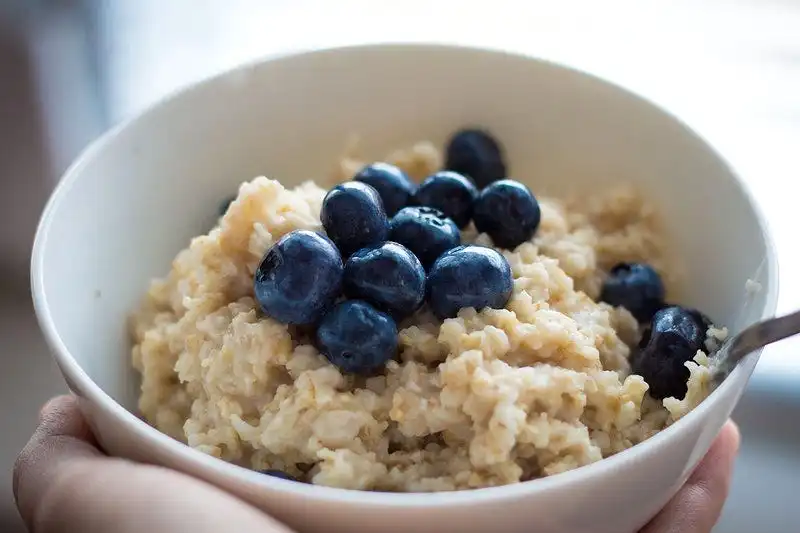 Bowl of oats with blueberries on top